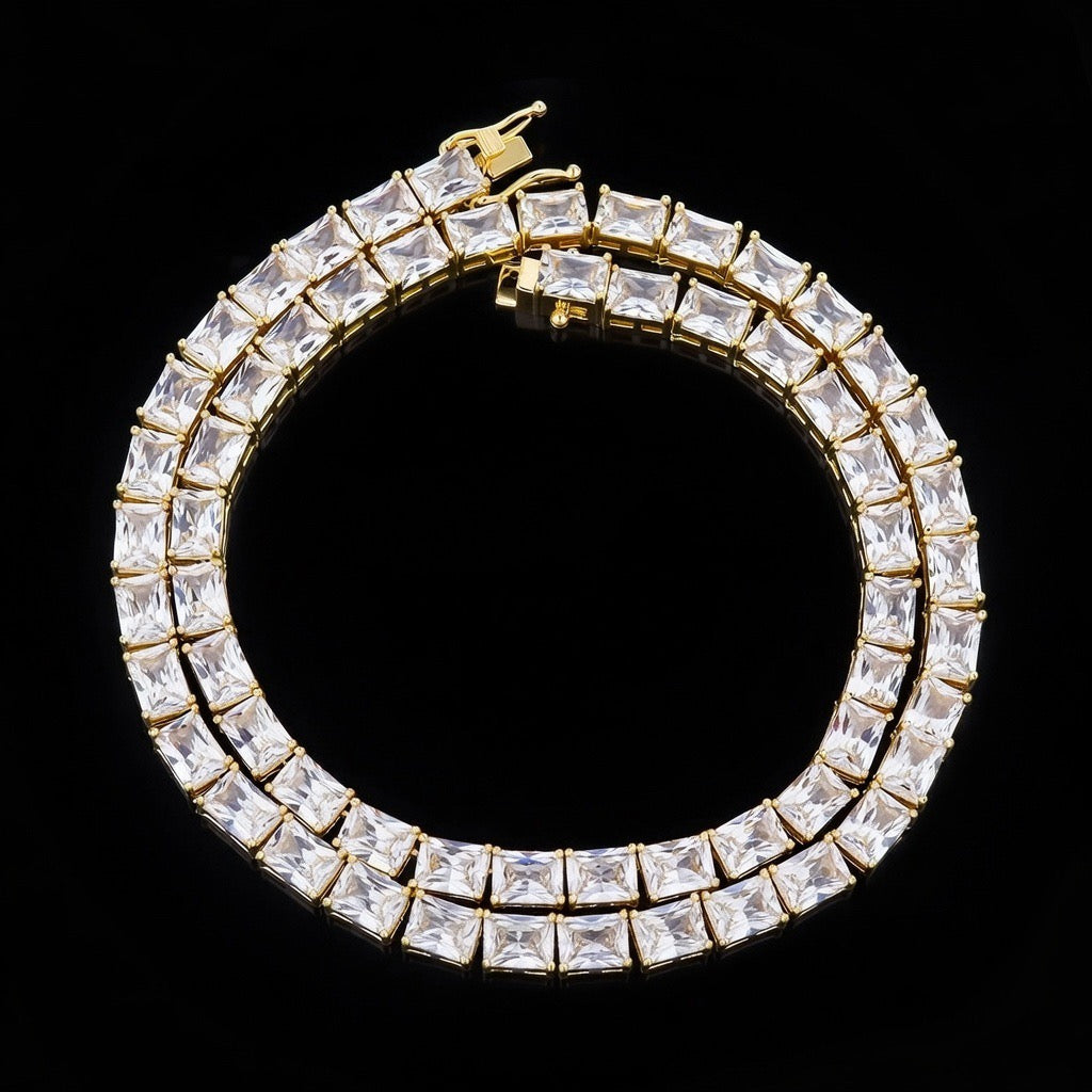Emerald cut diamond gold tennis chain close-up with precision-set stones